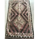A vintage brown, pink & cream Afghan Kelim rug.