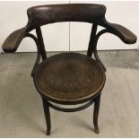A dark wood bentwood chair labelled Fischel of Czechoslovakia to underside.
