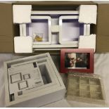 A new boxed wall hanging shelf together with a set of 3 wall cubes (new & sealed).