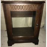 A modern dark wood "New Plan Furniture" glass fronted cabinet with lift up top.