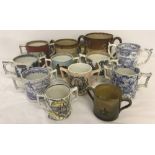 A collection of antique ceramic 2 handled loving cups.