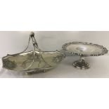 A heavy silver plated handled basket with fruit decoration.