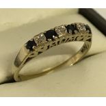 9ct gold ring set with 4 sapphires and 3 diamonds.