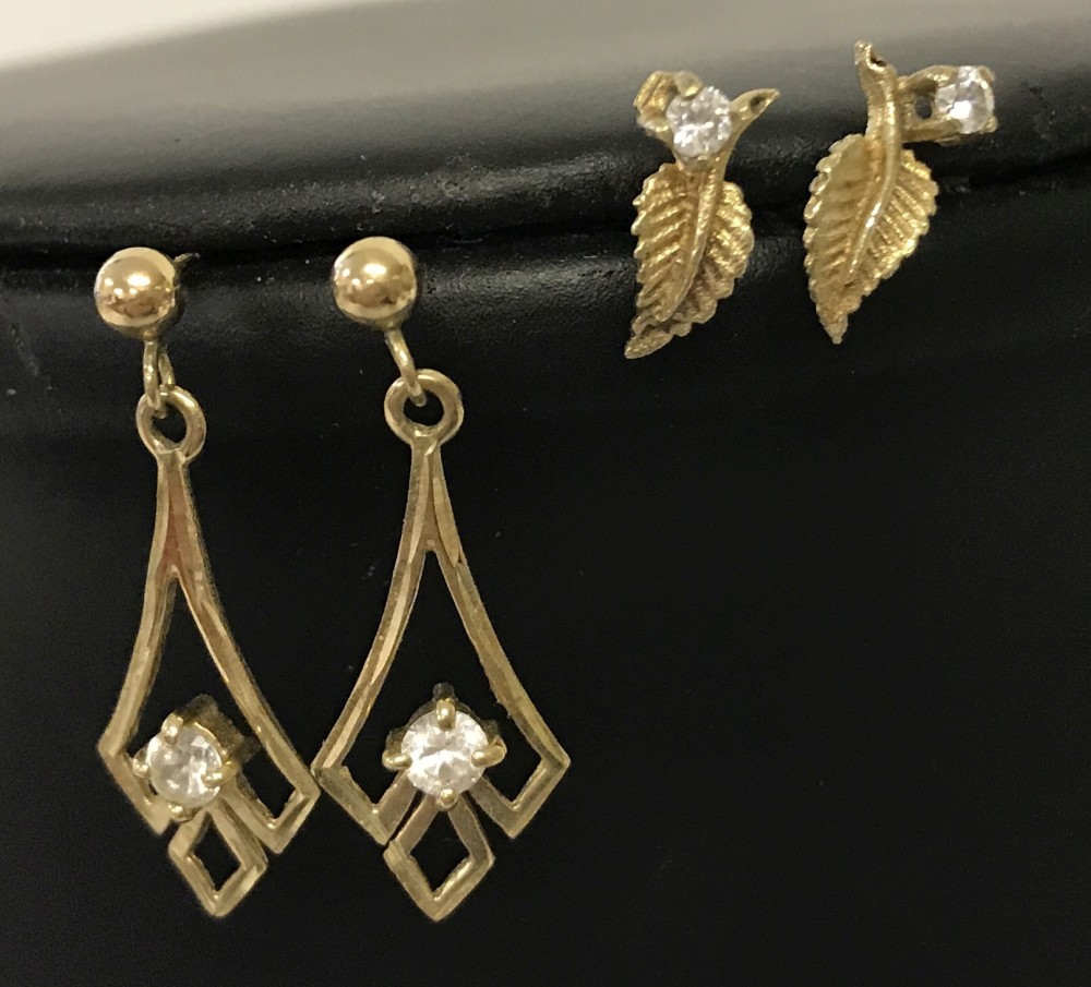 2 pairs of 9ct gold (tested) earrings set with cubic zirconias.