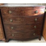 A Victorian mahogany bow fronted 4 draw chest with circular drop down handles.