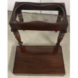 A Victorian mahogany bidet / side table with lift off lid, supported on turned legs.