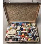 A suitcase containing a large collection of vintage matchboxes.
