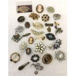 A collection of vintage brooches to include stone set and Miracle.