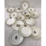A small collection of crested ware plates.