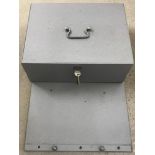 A metal lock box/safe. Complete with key and base plate to fix to.