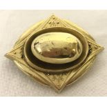 Gold Victorian mourning brooch with compartment at the back for hair or photo.