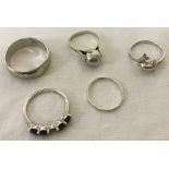 5 x silver rings of different designs.