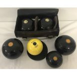 2 pairs of vintage crown green bowling bowls, together with 2 jacks.
