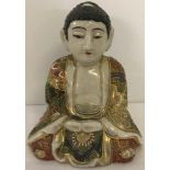 A Kutani ceramic Buddha.