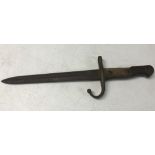 A circa WWI wooden handled bayonet with hooked quillion.