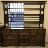 A large Georgian Oak dresser with plate rack.