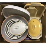 A box of assorted cooking dishes and bowls.