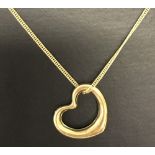 9ct gold floating heart pendant on a gold chain.