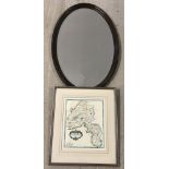 A vintage oval dark oak frame hanging mirror with bevel edge glass.