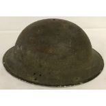 A WW2 pattern British tin helmet with liner.