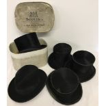 A collection of 4 vintage Top Hats with a vintage Fedora hat.