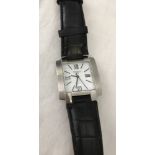 A men's Tissot wrist watch. Black leather strap.