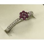 A 9ct white gold ruby and diamond dress ring.