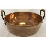 An antique copper jam pan.