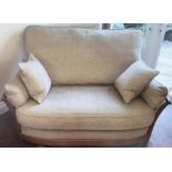 A modern Ercol 2 seater "Renaissance" settee with beige coloured upholstery