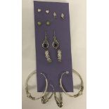 7 x pairs of silver earrings.