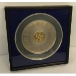 A mounted and framed hallmarked silver commemorative platter.