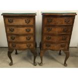 A pair of vintage walnut veneer curve fronted 4 drawer cabinets with shaped glass tops.