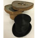A vintage Top Hat in it's leather carrying case.