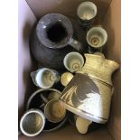 A box of mixed studio pottery to include jugs, mugs and goblets.