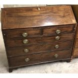 An early Victorian mahogany bureau with 5 graduated drawers.