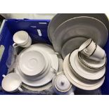 A quantity of mostly white ceramic dinner and tea ware.