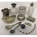 A collection of silver and white metal items.