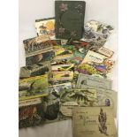 A large collection of assorted vintage cigarette and tea cards and albums.