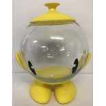 A modern Italian goldfish bowl with yellow character body.