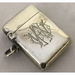 A hallmarked silver monogrammed vesta case.