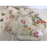 A quantity of vintage hand embroidered linen.