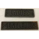 2 cast metal signs "ladies" and "gentlemen".