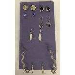 7 x pairs of silver earrings.