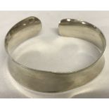 A ladies silver cuff bangle. Marked 925.