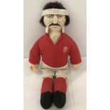 A c1980's soft toy doll of Welsh rugby player Mervyn Davies.