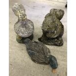 2 duck shaped concrete garden ornaments together with squirrel.