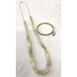 A silver 30 inch chain with white onyx beads together with a 9ct rolled gold bracelet.