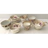 A collection of early 19th century cups & saucers.