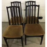 A set of 4 high back dining chairs with gold coloured velvet upholstery.