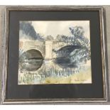 A framed and glazed water colour of a bridge and river scene.